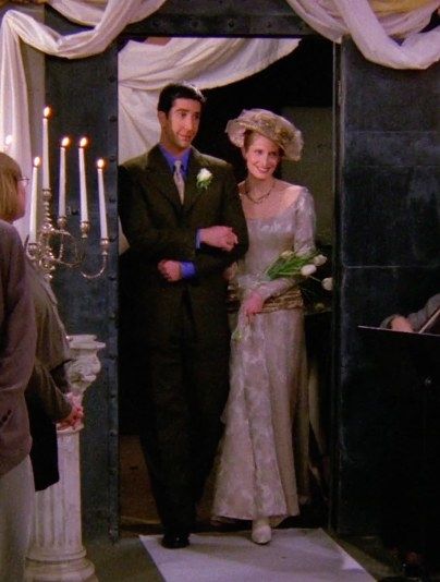 ross and carol walking on aisle